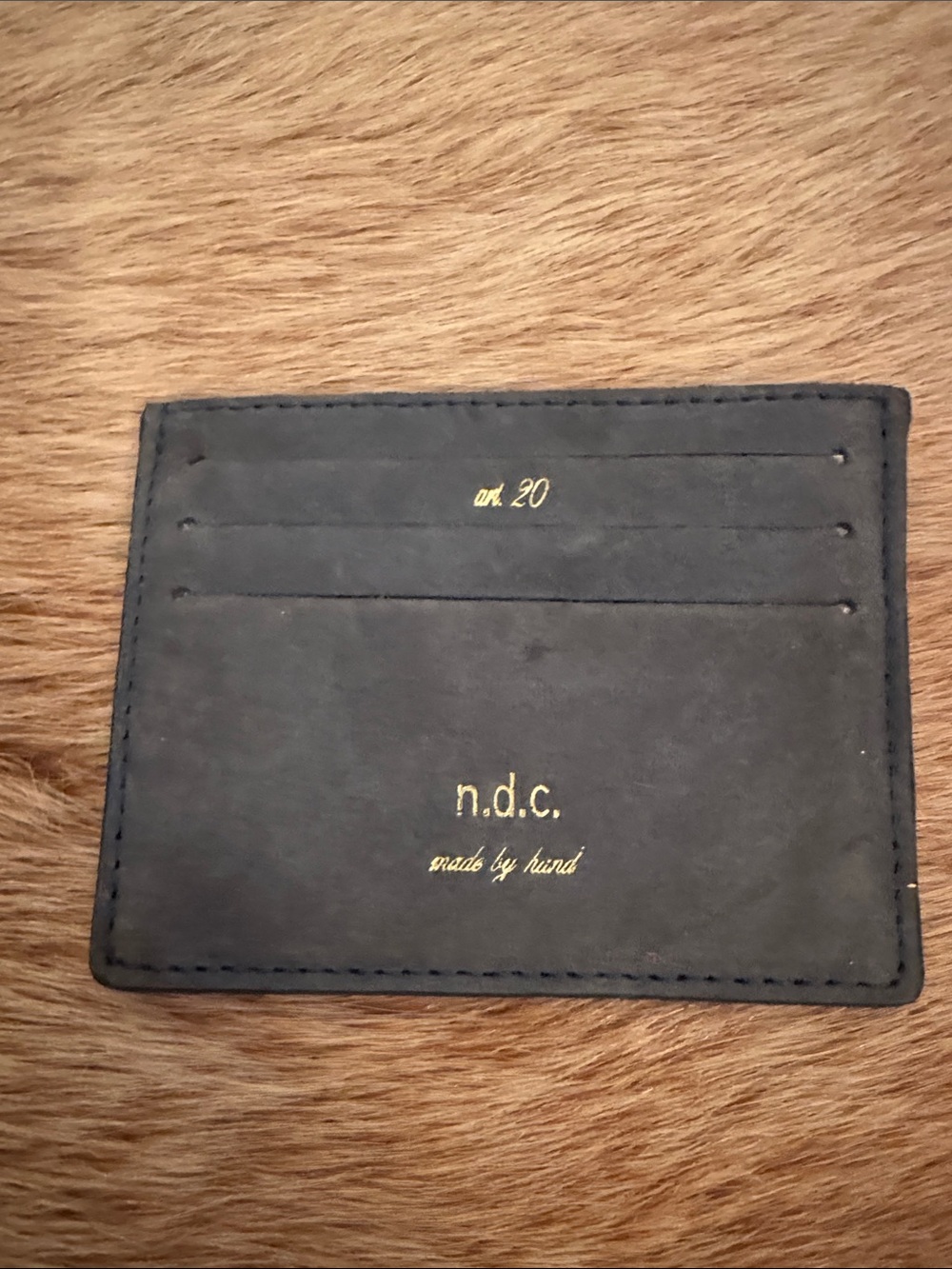 n.d.c. black leather card holder with gold foil logo